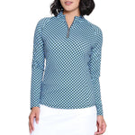Woman wearing a blue checkered shirt and white skirt on a white background