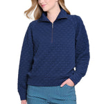 Woman wearing a blue patterned outfit on a white background