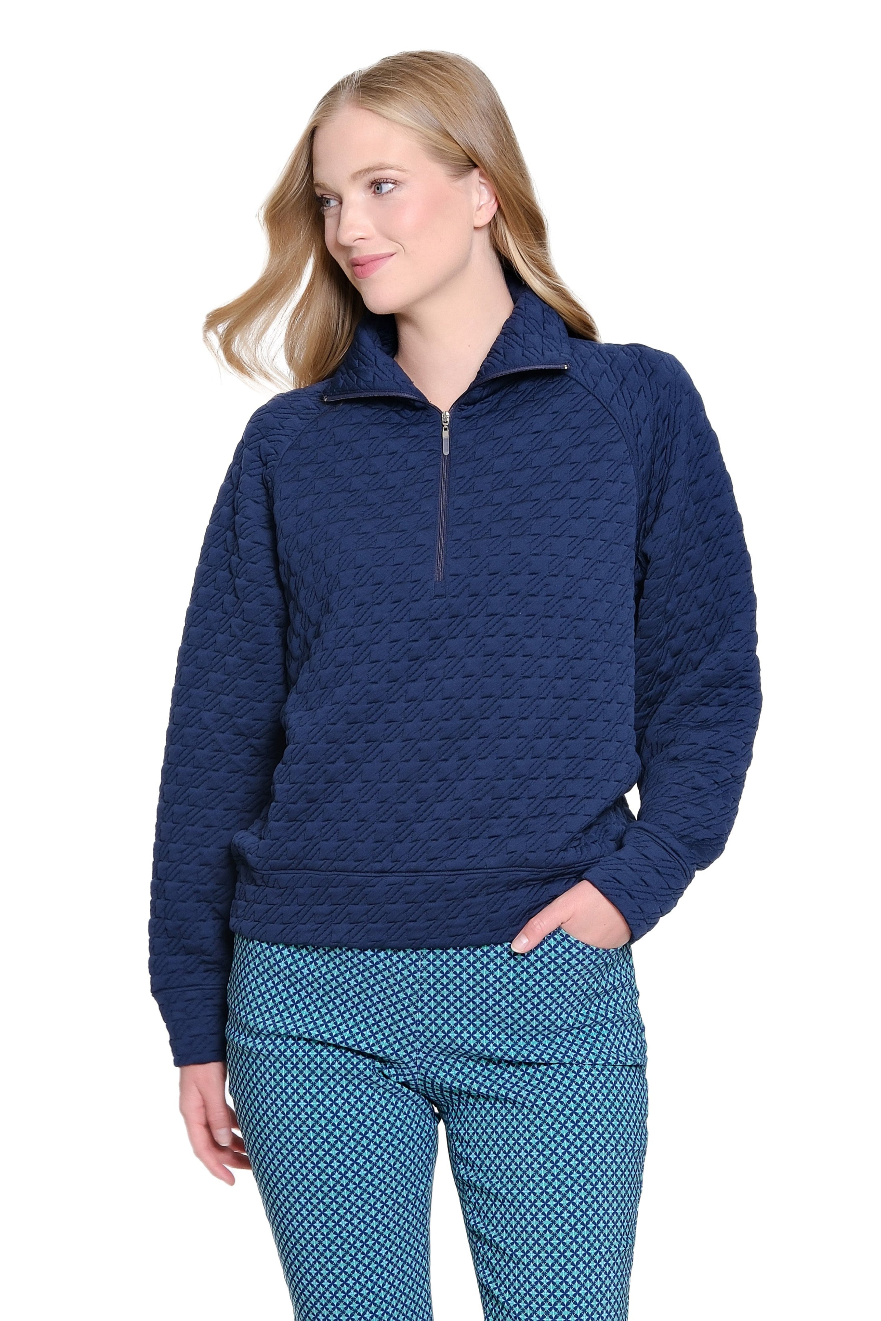 Woman wearing a blue patterned outfit on a white background