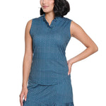 Woman wearing a blue polka dot dress on a white background