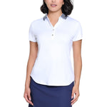Woman wearing a white polo shirt and navy skirt on a white background