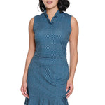 Woman wearing a blue polka dot dress on a white background